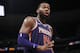 Phoenix Suns center Greg Monroe argues a call with a referee during the second half of the team's NBA basketball game against the Denver Nuggets on Wednesday, Jan. 3, 2018, in Denver. The Nuggets won 134-111. (AP Photo/David Zalubowski)
