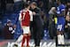 Chelsea head coach Antonio Conte, center, talks with Arsenal's Alexis Sanchez at the end of the English League Cup semifinal, first leg, soccer match between Chelsea and Arsenal at Stamford Bridge stadium in London, Wednesday, Jan. 10, 2018. (AP Photo/Kirsty Wigglesworth)