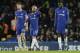 Chelsea's Cesc Fabregas, centre, Gary Cahill, left, and Tiemoue Bakayoko look dejected after Bournemouth's third goal during the English Premier League soccer match between Chelsea and Bournemouth at Stamford Bridge in London, Wednesday Jan. 31, 2018. (AP Photo/Tim Ireland)