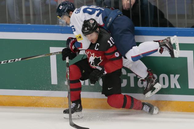 Canada's Derek Roy, bottom checks Korea's Shin Sang Woo during the Channel One Cup ice hockey match between Canada and Korea in Moscow, Russia, on Wednesday, Dec. 13, 2017.(AP Photo/Ivan Sekretarev)