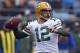 FILE - In this Dec. 17, 2017, file photo, Green Bay Packers' Aaron Rodgers looks to pass against the Carolina Panthers during the first half of an NFL football game in Charlotte, N.C. Rodgers wants to follow Tom Brady's path and still chuck it when he's in his 40s. He also accepts that in today's NFL he might again follow Brett Favre's footsteps and one day don something other than the green and gold. (AP Photo/Mike McCarn, File)