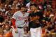 BALTIMORE, MD - JULY 10: Bryce Harper #34 of the Washington Nationals and Manny Machado #13 of the Baltimore Orioles talk during their game at Oriole Park at Camden Yards on July 10, 2015 in Baltimore, Maryland. (Photo by Rob Carr/Getty Images)