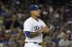 Los Angeles Dodgers' pitcher Julio Urias gathers himself after giving up a two-run double to the Miami Marlins J.T. Riddle in the third inning of a baseball game in Los Angeles, Saturday, May 20, 2017. (AP Photo/Michael Owen Baker)