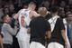 New York Knicks forward Kristaps Porzingis is helped off the court after being injured during the first half of the team's NBA basketball game against the Milwaukee Bucks, Tuesday, Feb. 6, 2018, at Madison Square Garden in New York. (AP Photo/Mary Altaffer)