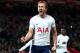 LIVERPOOL, ENGLAND - FEBRUARY 04: Harry Kane of Tottenham Hotspur celebrates after scoring his sides second goal and his 100th Premier League goal during the Premier League match between Liverpool and Tottenham Hotspur at Anfield on February 4, 2018 in Liverpool, England. (Photo by Clive Brunskill/Getty Images)