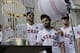 Houston Astros' Carlos Correa (1), Jose Altuve (27), and Alex Bregman (2) celebrate during a rally honoring the World Series baseball champions Friday, Nov. 3, 2017, in Houston. (AP Photo/David J. Phillip)