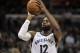 Memphis Grizzlies guard Tyreke Evans (12) plays in the second half of an NBA basketball game against the Sacramento Kings Friday, Jan. 19, 2018, in Memphis, Tenn. (AP Photo/Brandon Dill)