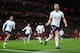 LIVERPOOL, ENGLAND - FEBRUARY 04: Harry Kane of Tottenham Hotspur celebrates with team mates after scoring his sides second goal and his 100th Premier League goal during the Premier League match between Liverpool and Tottenham Hotspur at Anfield on February 4, 2018 in Liverpool, England. (Photo by Clive Brunskill/Getty Images)