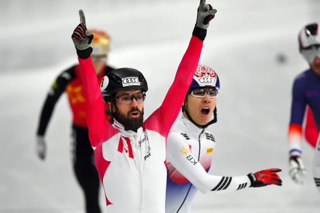 Charles Hamelin (front L) of Canada celebrates his victory as Hwang Dae-Heon (2nd L) of South Korea reacts after the men's 1500m final at the ISU World Cup Short Track Speed Skating in Seoul on November 18, 2017.
 / AFP PHOTO / JUNG Yeon-Je        (Photo credit should read JUNG YEON-JE/AFP/Getty Images)