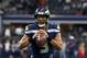Seattle Seahawks quarterback Russell Wilson (3) warms up before an NFL football game against the Dallas Cowboys on Sunday, Dec. 24, 2017, in Arlington, Texas. (AP Photo/Michael Ainsworth)