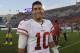 San Francisco 49ers quarterback Jimmy Garoppolo smiles as he walks off the field after their 34-13 win against the Los Angeles Rams during the second half of an NFL football game Sunday, Dec. 31, 2017, in Los Angeles. (AP Photo/Mark J. Terrill)