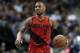 Portland Trail Blazers guard Damian Lillard (0) handles the ball during an NBA basketball game against the Dallas Mavericks on Friday, Jan. 26, 2018, in Dallas. (AP Photo/Tony Gutierrez)