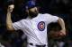FILE - In this Wednesday, Oct. 18, 201,7 file photo, Chicago Cubs starting pitcher Jake Arrieta throws during the first inning of Game 4 of baseball's National League Championship Series against the Los Angeles Dodgers in Chicago. Cubs pitchers Arrieta and Wade Davis were among nine free agents who turned down $17.4 million qualifying offers from their teams Thursday, Nov. 16, 2017. (AP Photo/Nam Y. Huh, File)