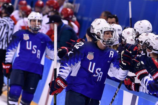 USA's Kacey Bellamy (C) is congratulated after scoring in the women's preliminary round ice hockey match between the US and Olympic Athletes from Russia during the Pyeongchang 2018 Winter Olympic Games at the Kwandong Hockey Centre in Gangneung on February 13, 2018.   / AFP PHOTO / Brendan Smialowski        (Photo credit should read BRENDAN SMIALOWSKI/AFP/Getty Images)