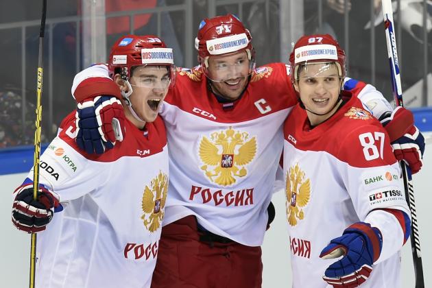 Russia's forward Ilya Kovalchuk (C), defenceman Bogdan Kisilevich (L) and forward Vadim Shipachev (R) celebrate a goal during the Channel One Cup of the Euro Hockey Tour ice hockey match between Russia and Finland in Moscow on December 19, 2015.  / AFP / ALEXANDER NEMENOV        (Photo credit should read ALEXANDER NEMENOV/AFP/Getty Images)