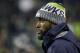 Injured Seattle Seahawks strong safety Kam Chancellor stands on the field before an NFL football game against the Atlanta Falcons, Monday, Nov. 20, 2017, in Seattle. (AP Photo/Ted S. Warren)