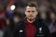 Liverpool's Belgian goalkeeper Simon Mignolet heads for the stands to watch the English FA Cup third round football match between Liverpool and Everton at Anfield in Liverpool, north west England on January 5, 2018. / AFP PHOTO / Paul ELLIS / RESTRICTED TO EDITORIAL USE. No use with unauthorized audio, video, data, fixture lists, club/league logos or 'live' services. Online in-match use limited to 75 images, no video emulation. No use in betting, games or single club/league/player publications. / (Photo credit should read PAUL ELLIS/AFP/Getty Images)
