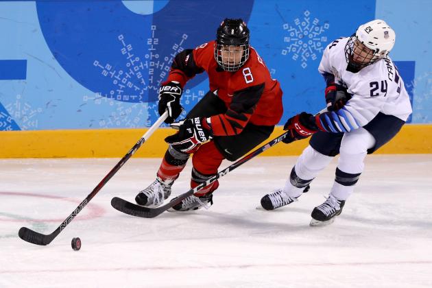 GANGNEUNG, SOUTH KOREA - FEBRUARY 15:  Laura Fortino #8 of Canada handles the puck against Danielle Cameranesi #24 of the United States during the Women's Ice Hockey Preliminary Round Group A game on day six of the PyeongChang 2018 Winter Olympic Games at Kwandong Hockey Centre on February 15, 2018 in Gangneung, South Korea.  (Photo by Maddie Meyer/Getty Images)