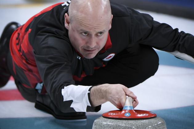 Canada's Kevin Koe throws the stone during the curling men's round robin session between Canada and Britain during the Pyeongchang 2018 Winter Olympic Games at the Gangneung Curling Centre in Gangneung on February 14, 2018. / AFP PHOTO / WANG Zhao        (Photo credit should read WANG ZHAO/AFP/Getty Images)