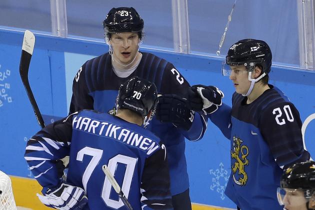 Joonas Kemppainen (23), of Finland, celebrates his goal with Teemu Hartikainen (70) and Eeli Tolvanen (20) during the third period of the preliminary round of the men's hockey game against Germany at the 2018 Winter Olympics in Gangneung, South Korea, Thursday, Feb. 15, 2018. (AP Photo/Matt Slocum)