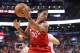 TORONTO, ON - FEBRUARY 13: DeMar DeRozan #10 of the Toronto Raptors handles a pass over his head against the Miami Heat at Air Canada Centre on February 13, 2018 in Toronto, Canada. NOTE TO USER: User expressly acknowledges and agrees that, by downloading and or using this photograph, User is consenting to the terms and conditions of the Getty Images License Agreement. (Photo by Tom Szczerbowski/Getty Images)