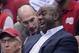 NBA Commissioner Adam Silver, left, talks with Magic Johnson as they watch the Los Angeles Clippers play the Oklahoma City Thunder in the first half of Game 4 of the Western Conference semifinal NBA basketball playoff series, Sunday, May 11, 2014, in Los Angeles. (AP Photo/Mark J. Terrill)