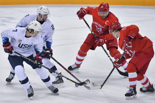 US John McCarthy, US Ryan Gunderson, Russia's Pavel Datsyuk and Russia's Nikita Gusev vie for the puck in the men's ice hockey preliminary round group B game between the Olympic Athletes from Russia and the United States during the Pyeongchang 2018 Winter Olympic Games at the Gangneung Hockey Centre in Gangneung on February 17, 2018. / AFP PHOTO / Ed JONES        (Photo credit should read ED JONES/AFP/Getty Images)