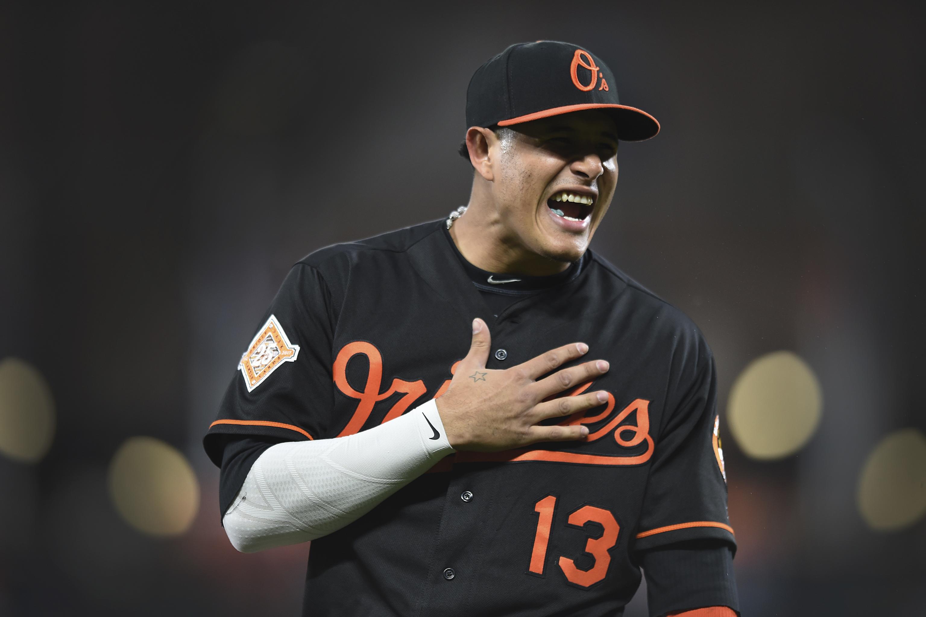 Why is Manny Machado wearing an orioles shirt under his Jersey? : r/mlb