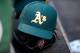 BALTIMORE, MD - AUGUST 15: An Oakland Athletics hat and glove on the steps of the dugout during the game against the Baltimore Orioles at Oriole Park at Camden Yards on August 15, 2015 in Baltimore, Maryland. (Photo by G Fiume/Getty Images)