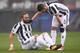 Juventus' forward Gonzalo Higuain from Argentina (L) reacts near Juventus' midfielder Miralem Pjanic of Bosnia-Herzegovina during the Italian Serie A football match between Torino and Juventus at Stadio Grande Torino in Turin on February 18, 2018. / AFP PHOTO / MARCO BERTORELLO (Photo credit should read MARCO BERTORELLO/AFP/Getty Images)