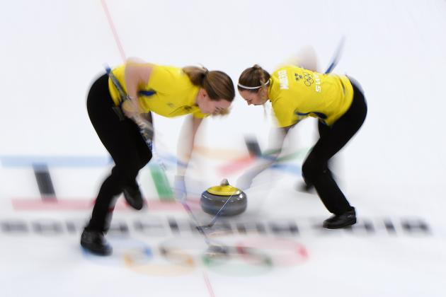 Sweden's Sofia Mabergs (R) brushes in front of the stone during the curling women's round robin session between Britain and Sweden during the Pyeongchang 2018 Winter Olympic Games at the Gangneung Curling Centre in Gangneung on February 18, 2018. / AFP PHOTO / WANG Zhao        (Photo credit should read WANG ZHAO/AFP/Getty Images)