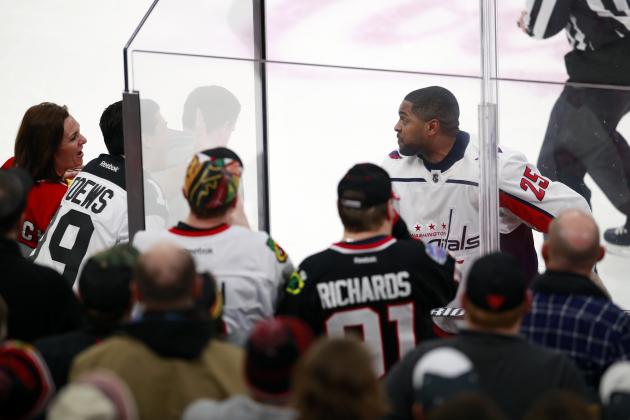 Washington Capitals right wing Devante Smith-Pelly (25) argues with Chicago Blackhawks fans from the penalty box during the third period of an NHL hockey game Saturday, Feb. 17, 2018, in Chicago. The Blackhawks won the game 7-1.(AP Photo/Jeff Haynes)