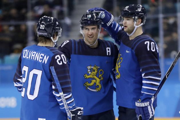 Sami Lepisto (18), of Finland, celebrates a goal with Eeli Tolvanen (20) and Teemu Hartikainen (70) during the third period of the preliminary round of the men's hockey game against Norway at the 2018 Winter Olympics in Gangneung, South Korea, Friday, Feb. 16, 2018. (AP Photo/Julio Cortez)