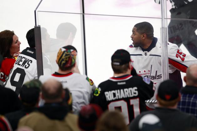 Washington Capitals right wing Devante Smith-Pelly (25) argues with Chicago Blackhawks fans from the penalty box during the third period of an NHL hockey game Saturday, Feb. 17, 2018, in Chicago. The Blackhawks won 7-1. (AP Photo/Jeff Haynes)