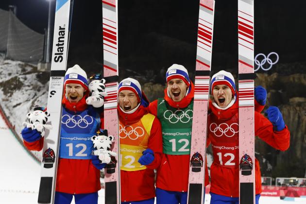 Norway's Robert Johansson, from left, Johann Andre Forfang, Andreas Stjernen and Daniel Andre Tande pose after winning the gold medal in the men's large hill team ski jumping competition at the 2018 Winter Olympics in Pyeongchang, South Korea, Monday, Feb. 19, 2018. (AP Photo/Kirsty Wigglesworth)