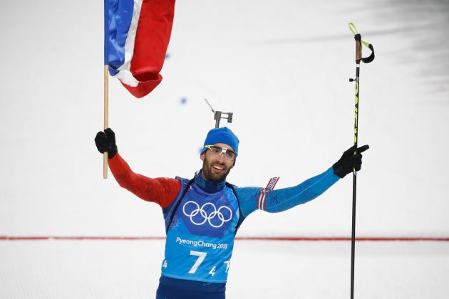 France's Martin Fourcade cross the finish line to win team gold in the mixed relay biathlon event during the Pyeongchang 2018 Winter Olympic Games on February 20, 2018, in Pyeongchang. / AFP PHOTO / Odd ANDERSEN (Photo credit should read ODD ANDERSEN/AFP/Getty Images)
