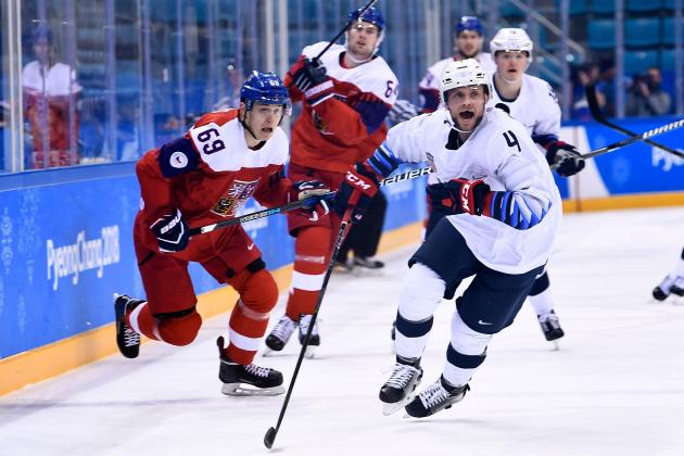 Czech Republic's Lukas Radil (L), USA's Chad Billins (R) and others chase the puck during the men's quarterfinals playoffs ice hockey match between Czech Republic the United States during the Pyeongchang 2018 Winter Olympic Games at the Gangneung Hockey Centre in Gangneung on February 21, 2018.   / AFP PHOTO / Brendan Smialowski        (Photo credit should read BRENDAN SMIALOWSKI/AFP/Getty Images)