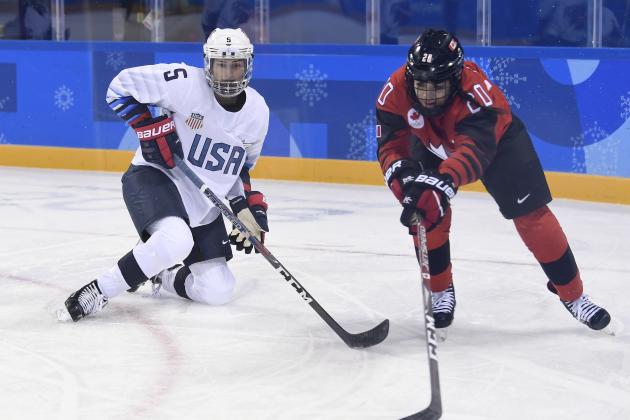 United States defenceman Megan Keller (5) and Canada forward Sarah Nurse (20) vie for the puck during preliminary round women's hockey action at the 2018 Olympic Winter Games in Pyeongchang, South Korea, on Thursday, February 15, 2018. (Nathan Denette/The Canadian Press via AP)