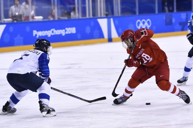 Russia's Olga Sosina (R) tires to get past Finland's Jenni Hiirikoski in the women's bronze medal ice hockey match between Finland and the Olympic Athletes  from Russia during the Pyeongchang 2018 Winter Olympic Games at the Kwandong Hockey Centre in Gangneung on February 21, 2018.   / AFP PHOTO / Brendan Smialowski        (Photo credit should read BRENDAN SMIALOWSKI/AFP/Getty Images)