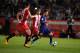 Girona's defender Juanpe Ramirez (L) vies with Barcelona's forward from Argentina Lionel Messi during the Spanish league football match Girona FC vs FC Barcelona at the Montilivi stadium in Girona on September 23, 2017. / AFP PHOTO / Josep LAGO (Photo credit should read JOSEP LAGO/AFP/Getty Images)