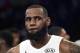 Team LeBron's LeBron James, of the Cleveland Cavaliers, looks on during the trophy ceremony following an NBA All-Star basketball game against Team Stephen, Sunday, Feb. 18, 2018, in Los Angeles. Team LeBron won 148-145. (AP Photo/Chris Pizzello)