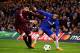 LONDON, ENGLAND - FEBRUARY 20: Eden Hazard of Chelsea is challenged by Gerard Pique of FC Barcelona during the UEFA Champions League Round of 16 First Leg match between Chelsea FC and FC Barcelona at Stamford Bridge on February 20, 2018 in London, United Kingdom. (Photo by Chris Brunskill Ltd/Getty Images)