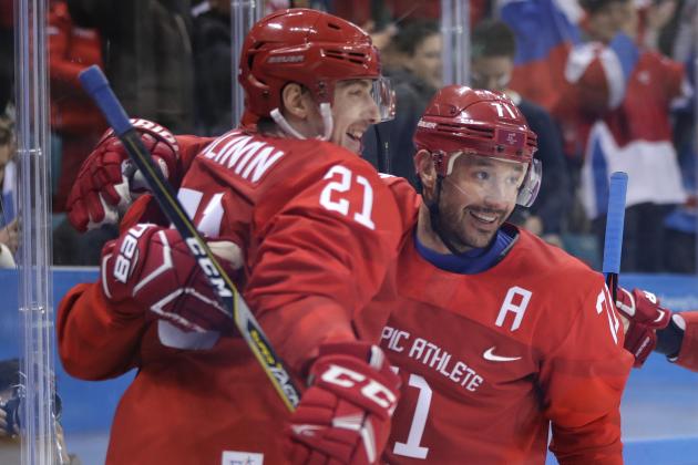 Russian athlete Sergei Kalinin (21) celebrates his goal with Russian athlete Ilya Kovalchuk (71) during the second period of the preliminary round of the men's hockey game against Slovenia at the 2018 Winter Olympics in Gangneung, South Korea, Friday, Feb. 16, 2018. (AP Photo/Julio Cortez)