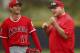 Los Angeles Angels' Shohei Ohtani, left, smiles at coach Mike Scioscia during a spring training baseball practice on Wednesday, Feb. 14, 2018, in Tempe, Ariz. (AP Photo/Ben Margot)