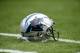 Carolina Panthers helmet sits on the field before an NFL football game between the Carolina Panthers and the Tampa Bay Buccaneers in Charlotte, N.C., Sunday, Dec. 24, 2017. (AP Photo/Mike McCarn)