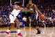Golden State Warriors' Draymond Green (23) high fives teammate Kevin Durant during the first half of an NBA basketball game against the Oklahoma City Thunder Tuesday, Feb. 6, 2018, in Oakland, Calif. (AP Photo/Marcio Jose Sanchez)
