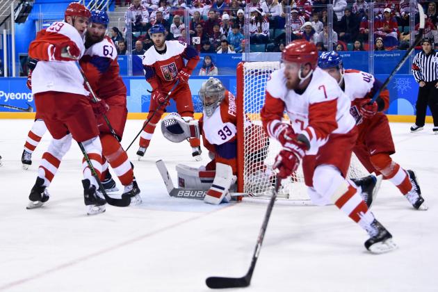 Russia's Ilya Kablukov (L) and Czech Republic's Adam Polasek (2nd L) watch as Russia's Ivan Telegin (2nd R) and Czech Republic's Petr Koukal (R) skate past in the men's semi-final ice hockey match between the Czech Republic and the Olympic Athletes from Russia during the Pyeongchang 2018 Winter Olympic Games at the Gangneung Hockey Centre in Gangneung on February 23, 2018.   / AFP PHOTO / Brendan Smialowski        (Photo credit should read BRENDAN SMIALOWSKI/AFP/Getty Images)