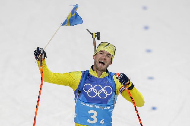 Fredrik Lindstroem, of Sweden, skis across the finish line to win the gold medal during the men's 4x7.5-kilometer biathlon relay at the 2018 Winter Olympics in Pyeongchang, South Korea, Friday, Feb. 23, 2018. (AP Photo/Andrew Medichini)
