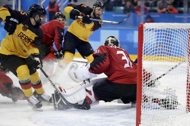Matthias Plachta (22), of Germany, shoot the puck past goalie Kevin Poulin (31), of Canada, for a goal during the second period of the semifinal round of the men's hockey game at the 2018 Winter Olympics in Gangneung, South Korea, Friday, Feb. 23, 2018. (AP Photo/Julio Cortez)