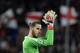 Manchester United's Spanish goalkeeper David de Gea applauds at the end of the UEFA Champions League round of 16 first leg football match Sevilla FC against Manchester United at the Ramon Sanchez Pizjuan stadium in Sevilla on February 21, 2018. / AFP PHOTO / Cristina Quicler (Photo credit should read CRISTINA QUICLER/AFP/Getty Images)